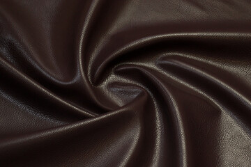 brown artificial leather with waves and folds on PVC base