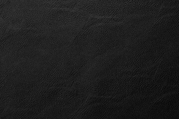 black artificial leather with waves and folds on PVC base