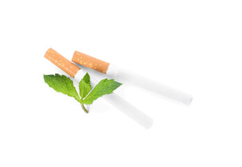 Menthol cigarettes and fresh mint leaves on white background, flat lay