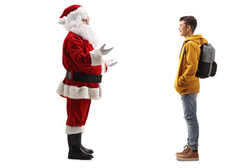 Santa Claus standing and talking to a male teenage student