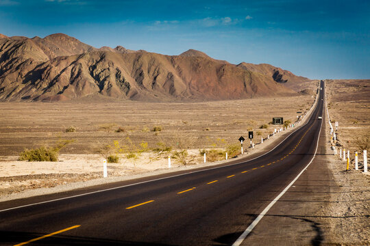 Road crossing the desert in Nazca area, Peru