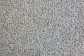 Abstract background from old gray old plaster on the concrete wall.