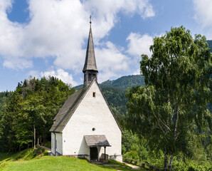 Fototapeta na wymiar Church Streichenkirche Sankt Servatius in the mountains near Schleching. Village Schleching in the Chiemgau in the Bavarian alps. Europe, Germany, Bavaria