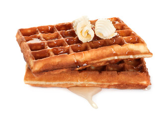 Delicious Belgian waffles with honey and butter on white background