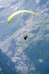 View of the paraglider against the Swiss mountains in the Grindelawald area.