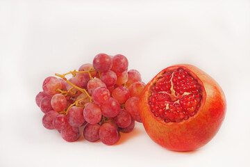 Ripe red pomegranate isolated on white background.