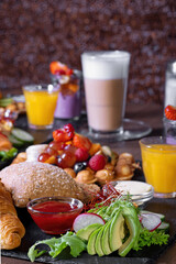 Breakfast or brunch set for two person on rustic wooden table