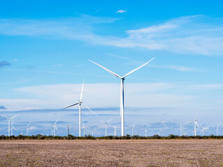 Modern Wind mills in open field