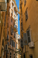 Fototapeta na wymiar Old narrow street, old buildings on Corfu island, Greece.