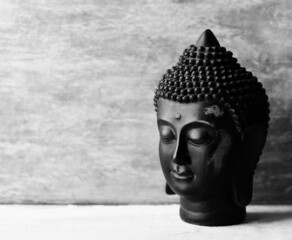 Meditating Buddha on wooden background. Soft focus. Close up. Copy space.	