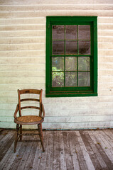Fototapeta na wymiar old wooden chair on porch