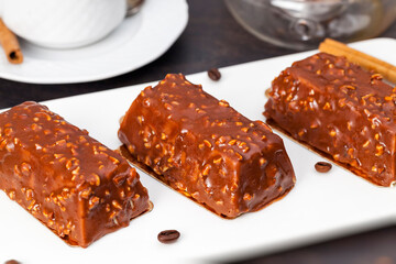 cake with peanuts poured with chocolate c