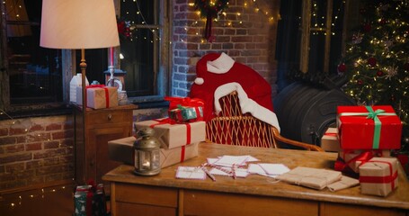 Magic atmosphere. View at the empty room of the Santa Clause with a lot of presents around. Holidays concept
