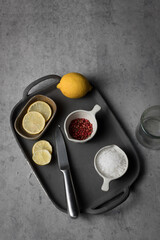 Ingredients for preparing a healthy recipe over a ceramic tray on a granite background.
