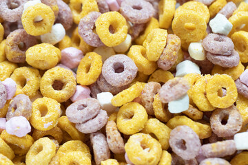 Multi colored cereal fruit loops food background. Closeup. Breakfast concept