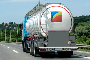 Isothermal Tank truck driving on highway. Oil and Gas Transportation and Logistics. Metal chrome cistern tanker with petrochemicals products. Liquid Chemical Freight. Soft focus possible granularity