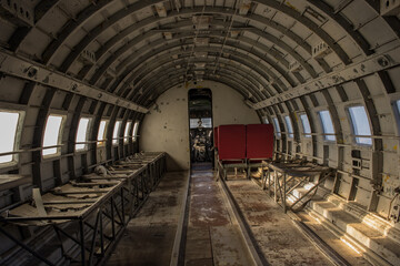 Interior of old, destroyed aircraft - IL-14. Abandoned plane interior.