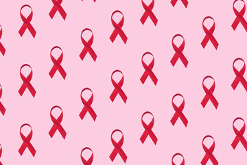 Red ribbons pattern symbol of world aids day on pink background