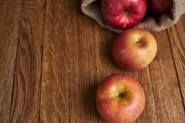 Naklejka na ściany i meble apples on a wooden table vitamins fresh fruits organic