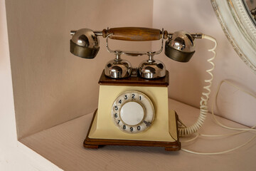 Old vintage telephone on table communication contact connection concept