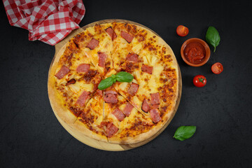 Round baked pizza on a wooden cutting board.