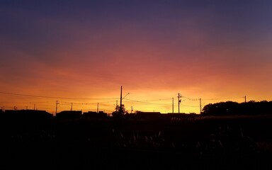 a sunset in a village