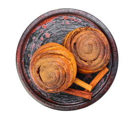 Plate of tasty cinnamon rolls on white background