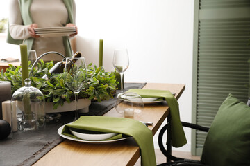 Dining table with beautiful setting for Christmas celebration indoors