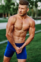 man with pumped up muscular body outdoors health workout