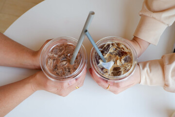 Two drinks collide in a cafe