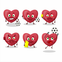Red love gummy candy cartoon character working as a Football referee