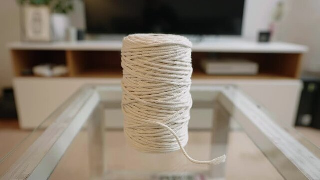white ball of decoration wool staying on a couch table.
dramatic vertigo shots