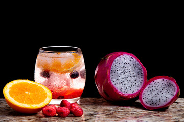 Cocktail with Raspberry, Blue Berry, Orange, Dragon Fruit, Gin and Tonic 1