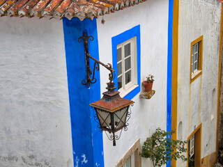 Portugal, Obidos. Graphic buildings inside the White walled town