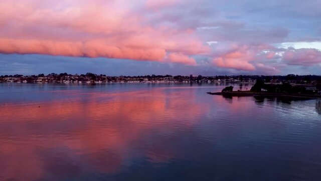 Massive clouds formation durring sunset over the water at Sylvania Waters.