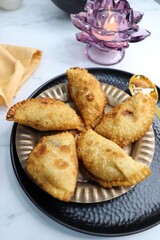 Indian Holi snack popuraly known as Gujia or Gujiya. Also called Karanji in Maharashtra, mostly eaten during Diwali. It is a deep fried sweet dish made from maida and stuffed with khoya or rava. copy.