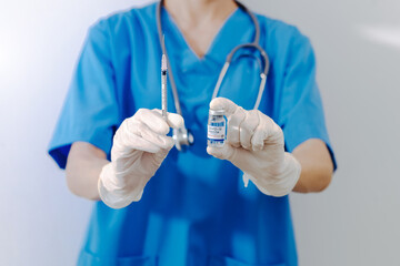 Scientist holding test tube with blood sample, focus on hand.