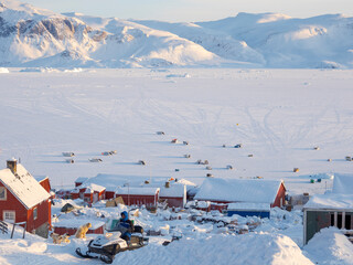 The traditional and remote Greenlandic Inuit village Kullorsuaq located at the Melville Bay, in the far north of West Greenland, Danish territory © Danita Delimont