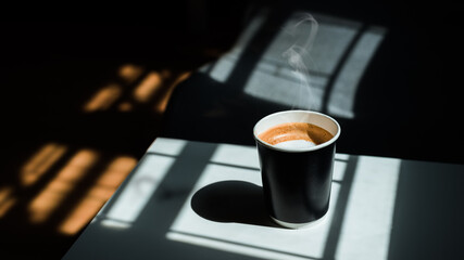Coffee latte on Black takeaway paper cup