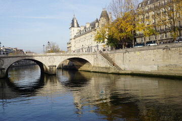 downtown  paris france with old stone bridge over seine river  in fall