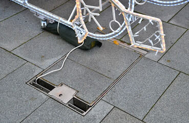 hatch for storing drawers and water inlets for watering and placing stalls in the square. the collector is hidden under the tiles. electric cable to install Christmas decorations