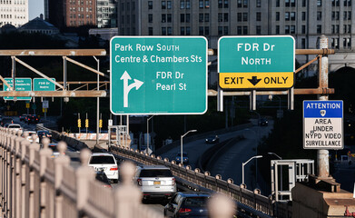 New York, USA - 2021: Traffic signs at the entrance to Manhattan from Brooklyn Bridge indicating the main streets an exits