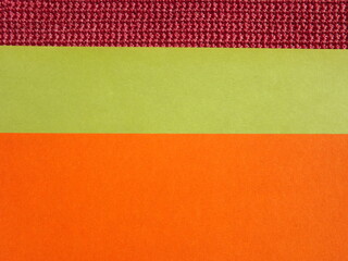 Fototapeta premium Orange green burgundy geometric surface as background. High quality photo