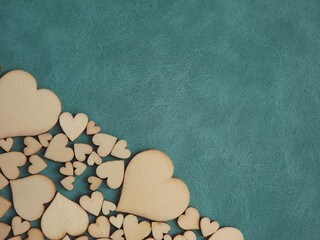 valentine's day greeting card-wooden hearts on a gray suede background. High quality photo
