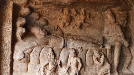 Mahishasuramartini Cave Temple. Sculptures carved in rock. Rock background