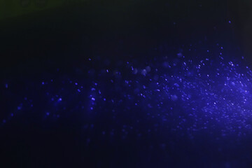 background of abstract blue and black glitter lights. defocused