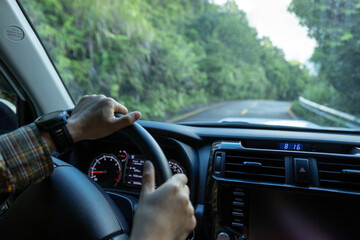 People driving car on mountain road