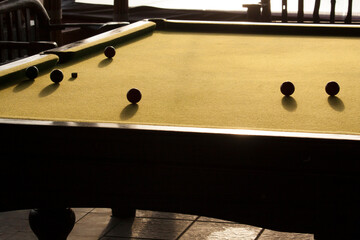 Backlit balls on a pool or billiards table.