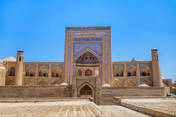 Fototapeta na wymiar Madrasah of Abdullah Khan in Khiva, Uzbekistan. Built in 1855 with the money of the Khan's mother in memory of his death in battle