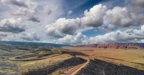 Aerial view of beautiful road corssing the canyon in summer season. Drone viewpoint at sunset
